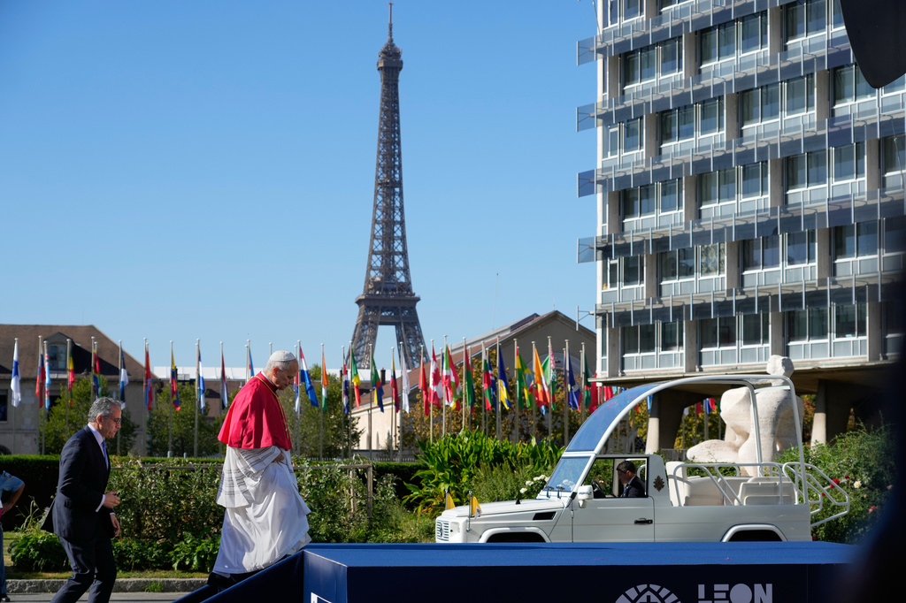 Pope Leo XIV, followed by Director-General Khaled El-Enany, leaves UNESCO headquarters, Friday, Sept. 25, 2026, in Paris. (AP Photo/Gregorio Borgia)