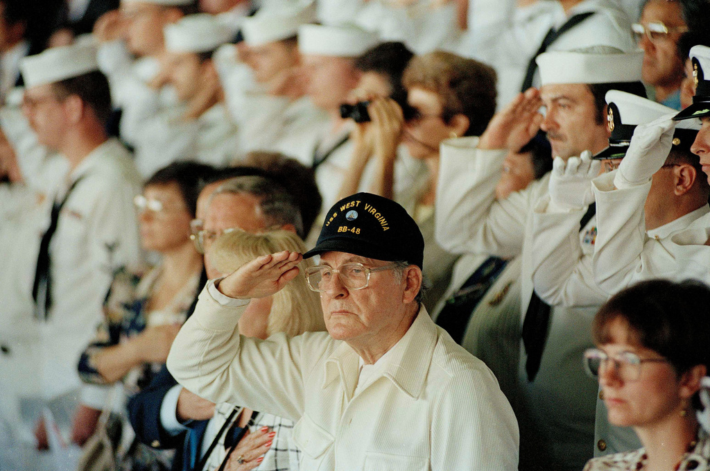 FILE - Pearl Harbor survivor Archie Odom, of Federal Way, Wash., salutes during a moment of silence in Pearl Harbor, Hawaii, Dec. 7, 1991, in remembrance of those killed during the Japanese attack on Pearl Harbor. Odom was a signalman on the bridge of the USS West Virginia when the Japanese attacked. (AP Photo/John Gaps III, File)