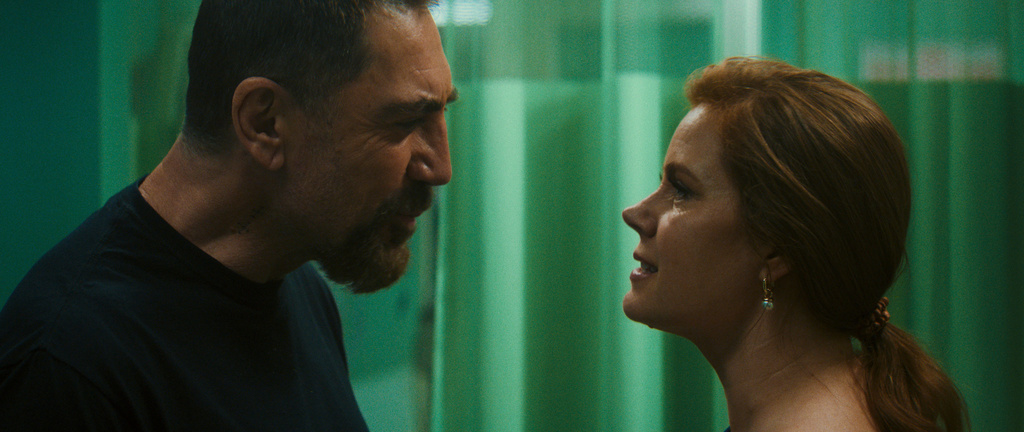 This image released by Apple shows Javier Bardem, left, and Amy Adams in a scene from "Cape Fear." (Apple via AP)