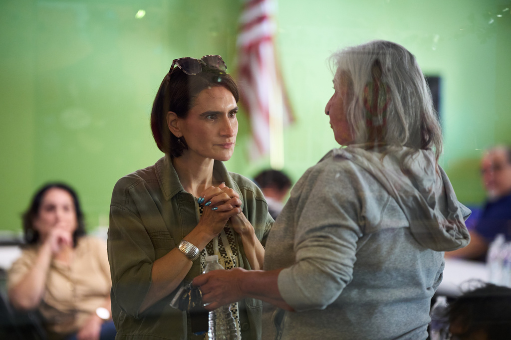 Minnesota Lt. Gov. Peggy Flanagan, a Democratic candidate for U.S. Senate, listens to a voter during a campaign event at the Leech Lake Band of Ojibwe Twin Cities Office in Minneapolis, Saturday, Aug. 8, 2026. (AP Photo/Ellen Schmidt)