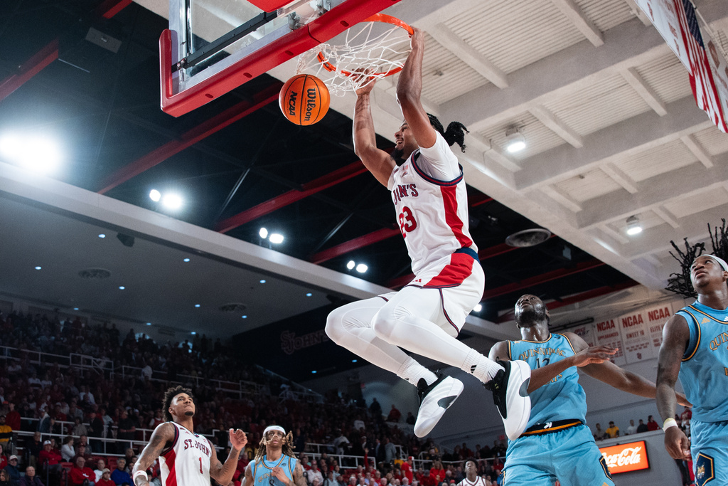 St. John's forward Bryce Hopkins (23) dunks during the second half of an NCAA college basketball game against Quinnipiac, Monday, Nov. 3, 2025, in New York. (AP Photo/Angelina Katsanis)