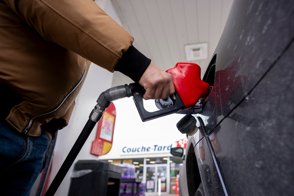 A person fills up their car at a gas station in Montreal on Thursday, March 5, 2026. (Christopher Katsarov /The Canadian Press via AP)