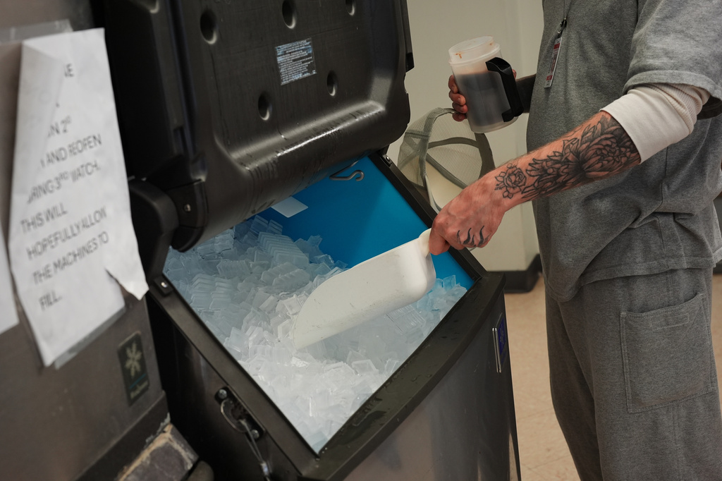 A person who is incarcerated scoops ice into his drink at a Minnesota Correctional Facility in Lino Lakes, Minn., Tuesday, Sept. 15, 2026. (AP Photo/Ellen Schmidt)