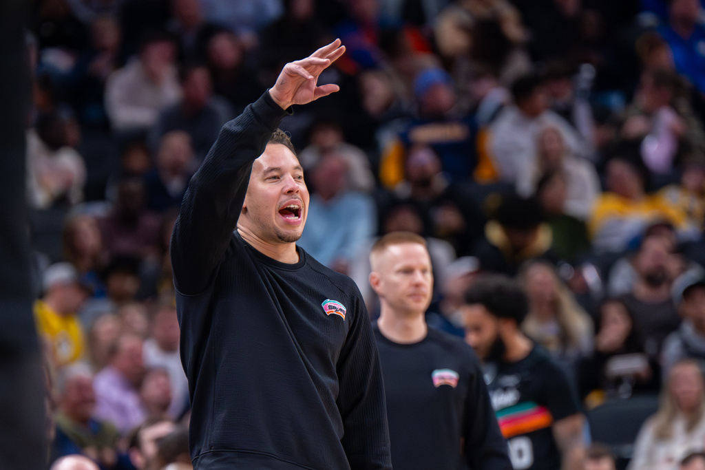 San Antonio Spurs head coach Mitch Johnson gestures during the first half of an NBA basketball game against the Indiana Pacers in Indianapolis, Friday, Jan. 2, 2026. (AP Photo/Doug McSchooler)
