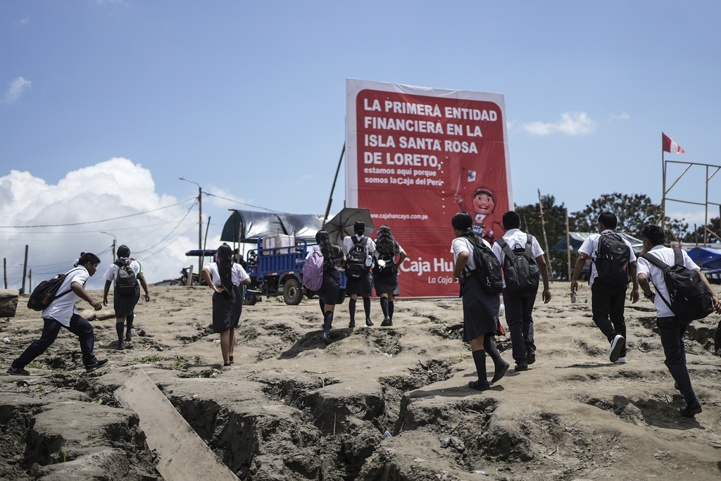 Students arrive in Santa Rosa, Peru, where they attend school, after crossing the Amazon River from Tabatinga, Brazil, Monday, Aug. 18, 2025. (AP Photo/Ivan Valencia)