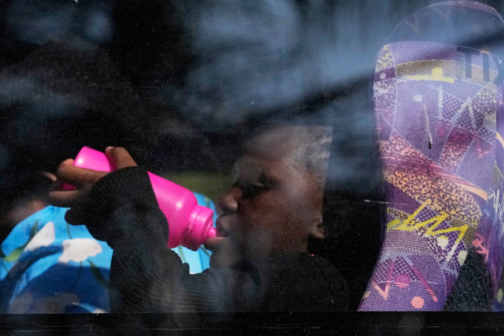 A Malawian young girl sits inside a bus for their deportation at a temporary centre, in Durban, South Africa, Thursday, June 18, 2026. (AP Photo/Themba Hadebe)
