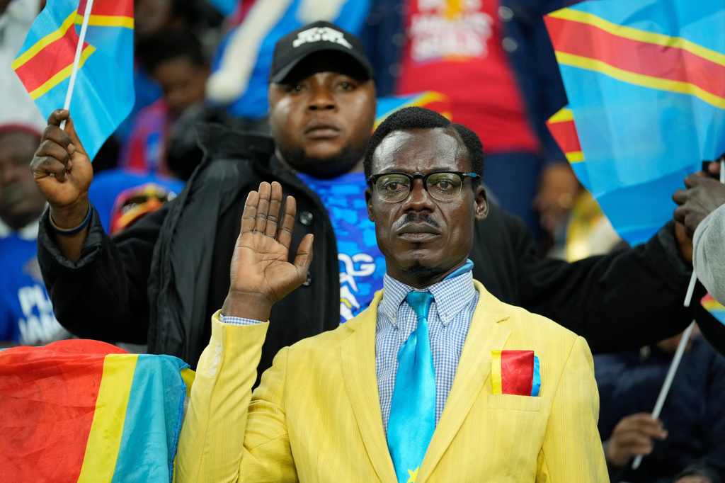 FILE - Michel Nkuka Mboladinga, a DR Congo fan impersonating late Congolese leader Patrice Lumumba, strikes a pose during the Africa Cup of Nations group D soccer match between Botswana and DR Congo in Rabat, Morocco, Tuesday, Dec. 30, 2025. (AP Photo/Mosa'ab Elshamy, File)