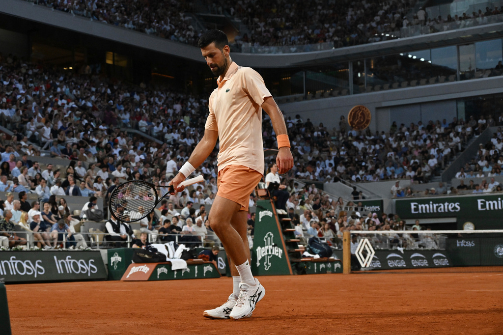 Novak Djokovic of Serbia walks as he plays against Giovanni Mpetshi Perricard of France during their first round men's singles tennis match at the French Open tennis tournament in Paris, Sunday, May 24, 2026. (AP Photo/Emma Da Silva)