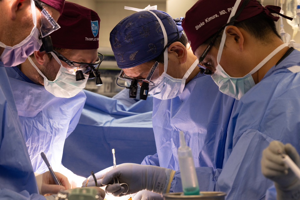 In this photo provided by Mass General Brigham, from left, surgeons Dr. Nahel Elias, Dr. Alban Longchamp, Dr. Tatsuo Kawai and Dr. Shoko Kimura transplant a genetically edited pig kidney into Bill Stewart June 14, 2025 at Massachusetts General Hospital in Boston. (Sarah Evans/Mass General Brigham via AP)