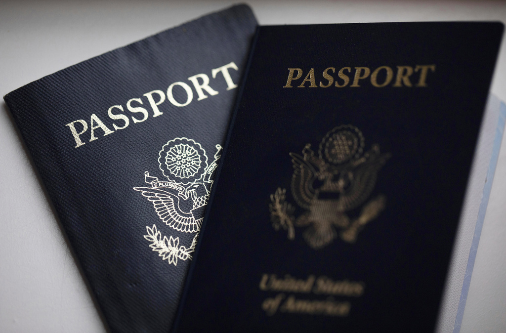 FILE - U.S. passports are arranged for a photograph in Tigard, Ore., Dec. 11, 2021. (AP Photo/Jenny Kane, File)