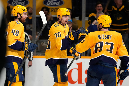 Nashville Predators left wing Cole Smith (36) is congratulated by defenseman Adam Wilsby (83) after Smith scored against the Los Angeles Kings during the second period of an NHL hockey game Saturday, Oct. 25, 2025, in Nashville, Tenn. (AP Photo/Mark Humphrey) Nashville Predators left wing Cole Smith (36) is congratulated by defenseman Adam Wilsby (83) after Smith scored against the Los Angeles Kings during the second period of an NHL hockey game Saturday, Oct. 25, 2025, in Nashville, Tenn. (AP Photo/Mark Humphrey)