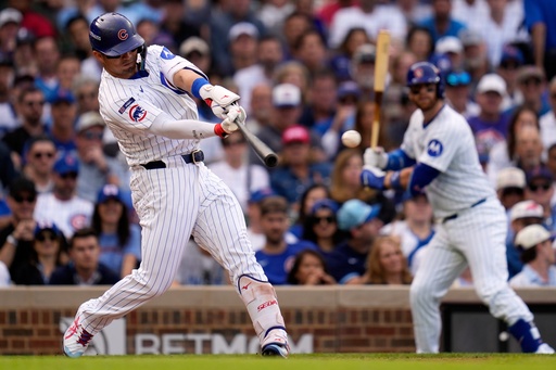 Chicago Cubs' Seiya Suzuki hits a double during the fourth inning of Game 2 of a National League wild card baseball game against the San Diego Padres Wednesday, Oct. 1, 2025, in Chicago. (AP Photo/Erin Hooley) Chicago Cubs' Seiya Suzuki hits a double during the fourth inning of Game 2 of a National League wild card baseball game against the San Diego Padres Wednesday, Oct. 1, 2025, in Chicago. (AP Photo/Erin Hooley)