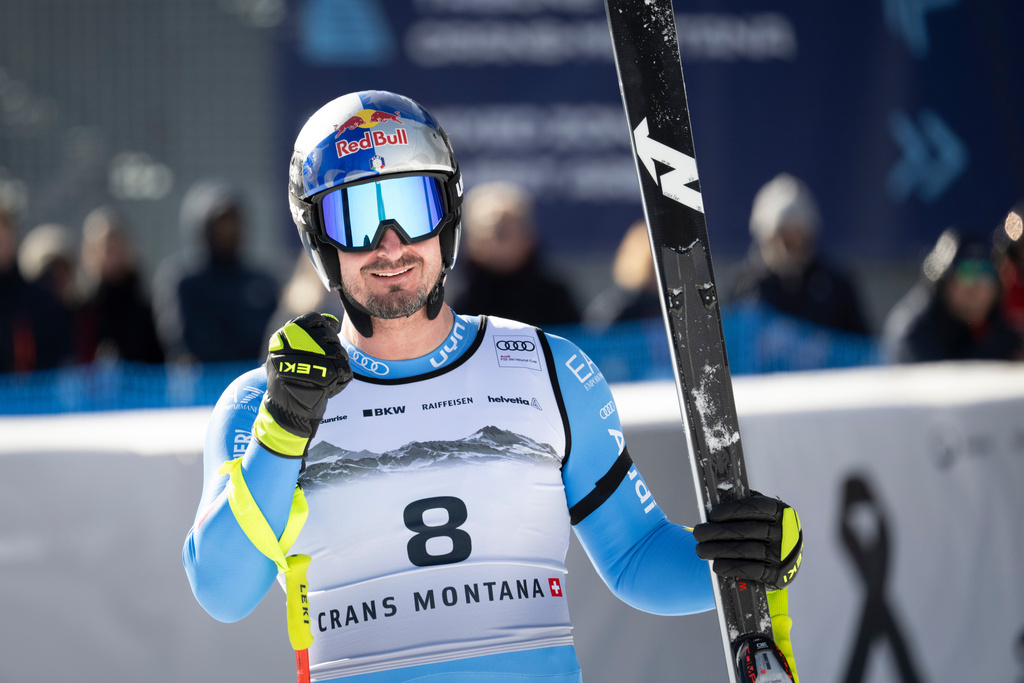 Italy's Dominik Paris celebrates at the finish area of an alpine ski, men's World Cup downhill, in Crans Montana, Switzerland, Sunday, Feb. 1, 2026. (Alessandro della Valle/Keystone via AP)