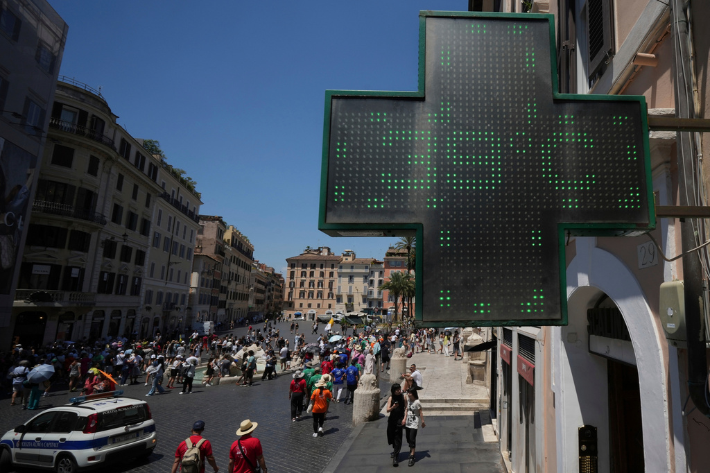 FILE - The thermometer of a drugstore shows the temperature of 39 degrees Celsius (102 degrees Fahrenheit) during a heat wave in Rome on July 1, 2025. (AP Photo/Andrew Medichini, File)
