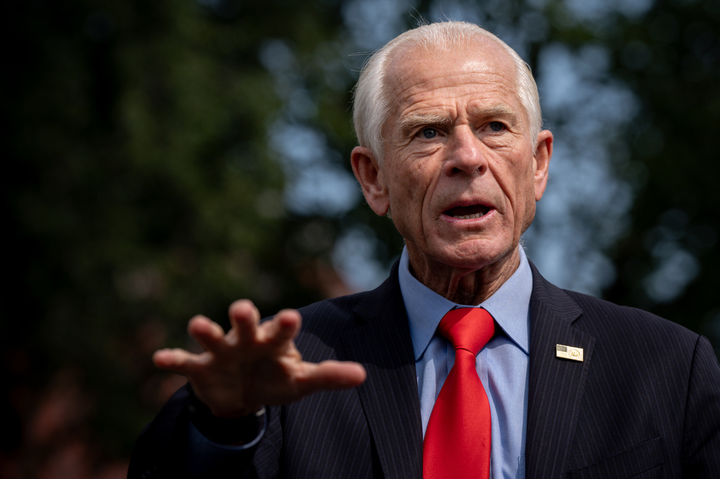 White House trade counselor Peter Navarro speaks with reporters following a video interview with Real America's Voice News, Tuesday, Aug. 11, 2026, outside the White House in Washington. (AP Photo/Julia Demaree Nikhinson)