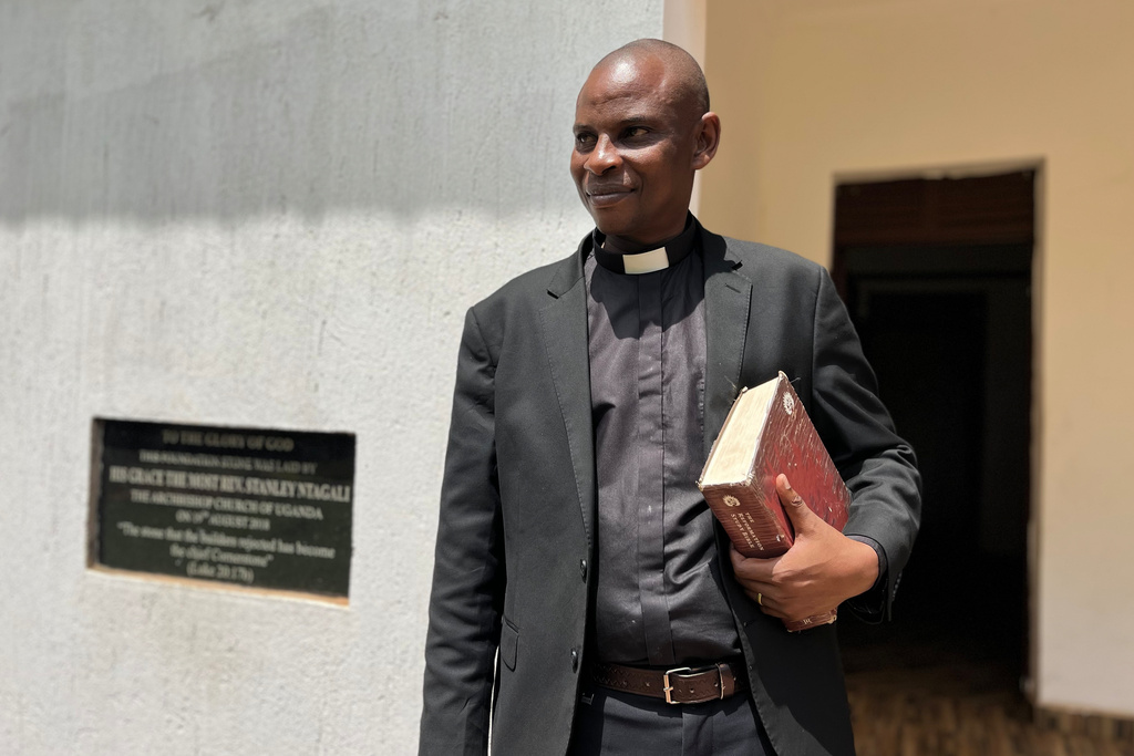 The Rev. Robert Wantsala, vicar of a small Anglican parish in eastern Uganda, stands at the headquarters of the diocese in Mbale, Uganda, Thursday, Nov. 20, 2025. (AP Photo/Rodney Muhumuza)