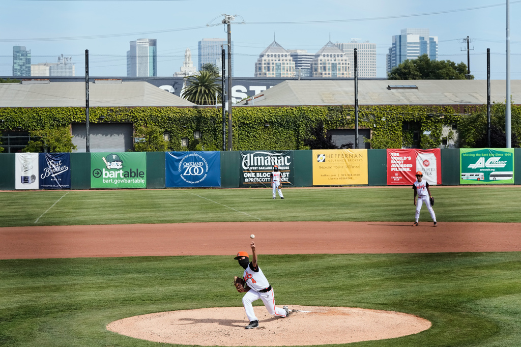 McClymonds High School pitcher Madden Kang (4) throws to a Skyline High School batter during the first inning of a baseball game in Oakland, Calif., Friday, May 1, 2026. (AP Photo/Godofredo A. Vásquez)