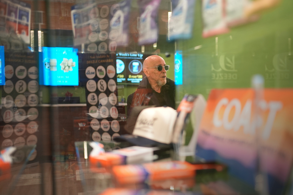 Miguel Laboy shops at a cannabis dispensary Friday, Nov. 14, 2025, in Brookline, Mass. (AP Photo/Robert F. Bukaty)