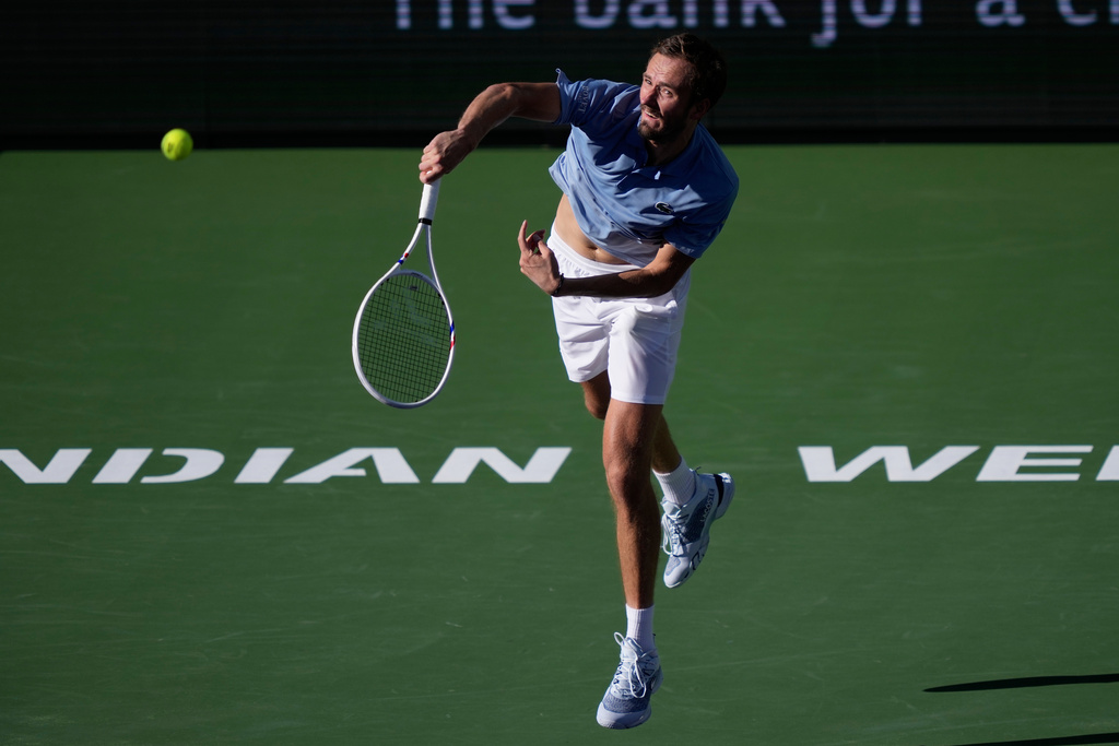 Daniil Medvedev, of Russia, serves against Carlos Alcaraz, of Spain, during a semifinal match at the BNP Paribas Open tennis tournament, Saturday, March 14, 2026, in Indian Wells, Calif. (AP Photo/Mark J. Terrill)