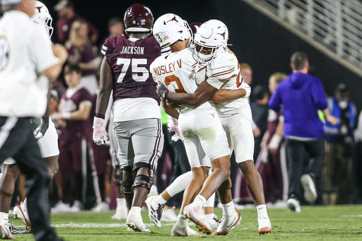 Texas defensive back Jaylon Guilbeau (3) celebrates with linebacker Ty'Anthony Smith, right, during overtime of an NCAA college football game against Mississippi State in Starkville, Miss., Saturday, Oct. 25, 2025. (AP Photo/James Pugh) Texas defensive back Jaylon Guilbeau (3) celebrates with linebacker Ty'Anthony Smith, right, during overtime of an NCAA college football game against Mississippi State in Starkville, Miss., Saturday, Oct. 25, 2025. (AP Photo/James Pugh)