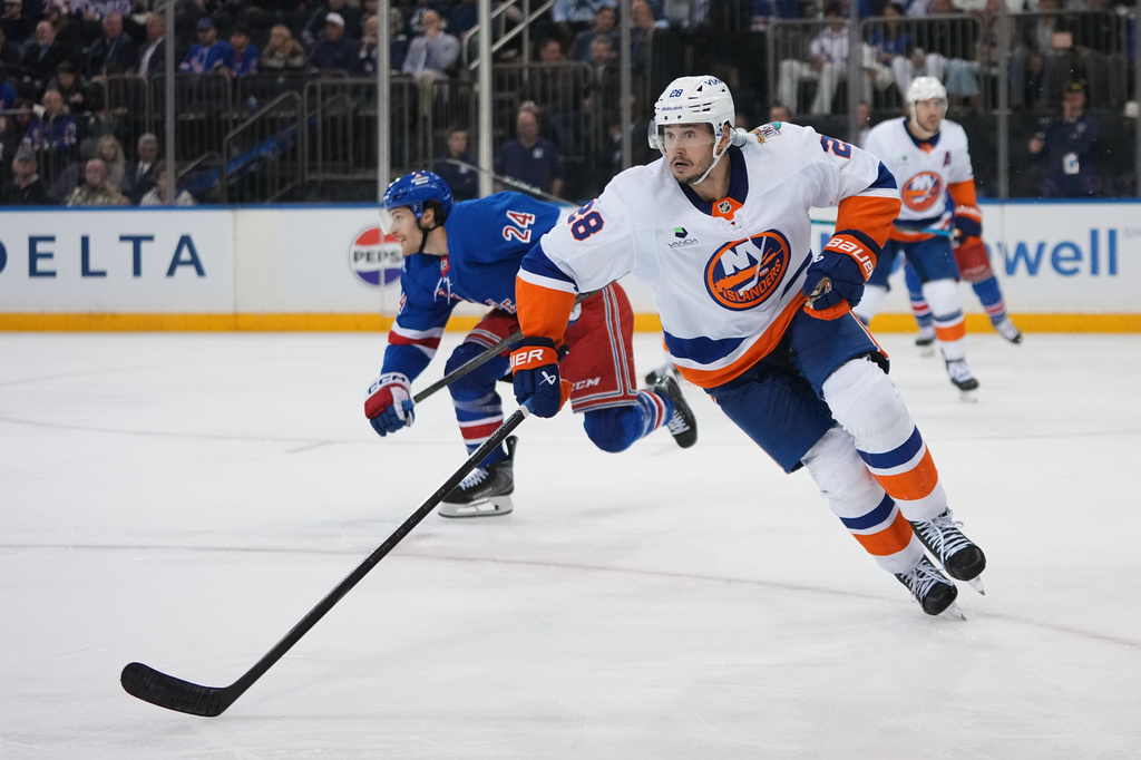 FILE - New York Islanders' Alexander Romanov (28) during the second period of an NHL hockey game against the New York Rangers Tuesday, Oct. 6, 2026, in New York. (AP Photo/Frank Franklin II, File)