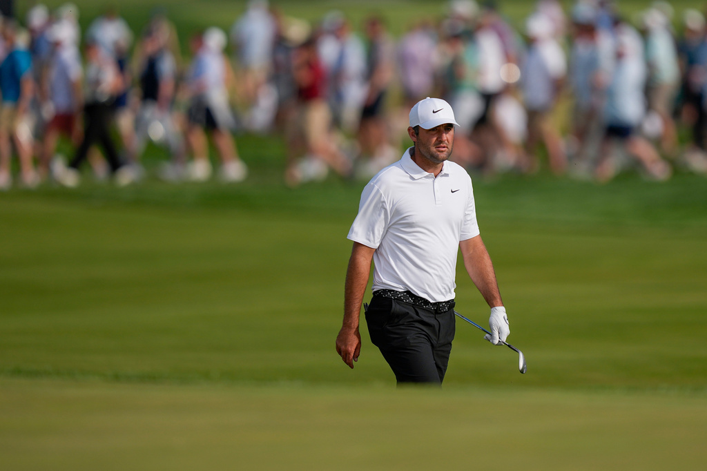 Scottie Scheffler walks up the 16th fairway during the third round of the PGA Championship golf tournament at Aronimink Golf Club, Saturday, May 16, 2026, in Newtown Square, PA. (AP Photo/Matt Slocum)