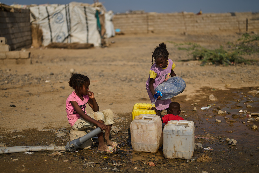 Internally displaced Sudanese children collect water at the Al Heshan camp in Port Sudan, Sudan, Wednesday, April 15, 2026. (AP Photo/Bernat Armangue)