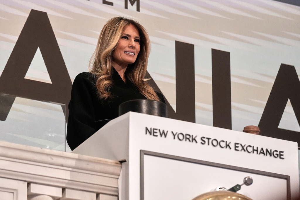 First lady Melania Trump poses for photos on the podium after ringing the New York Stock Exchange opening bell, Wednesday, Jan. 28, 2026. (AP Photo/Richard Drew)
