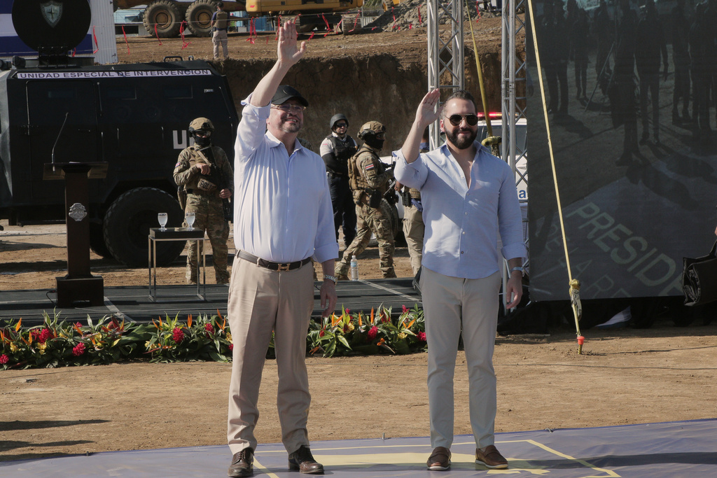 Costa Rica's President Rodrigo Chaves, left, and El Salvador's President Nayib Bukele wave during a groundbreaking ceremony of a high security prison in Alajuela, Costa Rica, Wednesday, Jan. 14, 2026. (AP Photo/Carlos Leon)