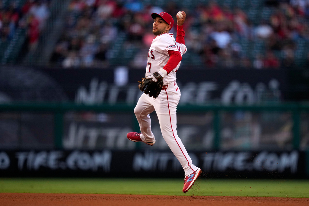 Los Angeles Angels second baseman Nick Madrigal throws out Colorado Rockies' Jake McCarthy at first during the third inning of a baseball game Wednesday, June 3, 2026, in Anaheim, Calif. (AP Photo/Mark J. Terrill)