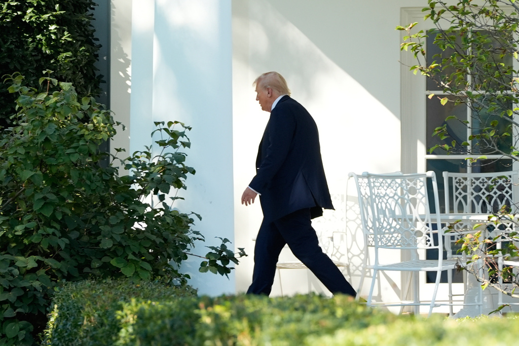 President Donald Trump walks from the Oval Office to board Marine One on the South Lawn of the White House, Friday, Oct. 10, 2025, in Washington, as he heads to Walter Reed National Military Center. (AP Photo/Alex Brandon)