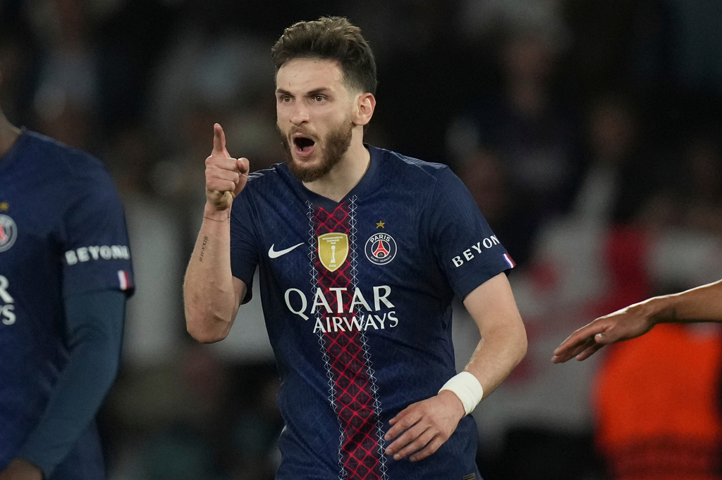 PSG's Khvicha Kvaratskhelia celebrates after scoring his side's fourth goal during the Champions League semifinal first leg soccer match between Paris Saint-Germain and Bayern Munich in Paris, Tuesday, April 28, 2026. (AP Photo/Christophe Ena)