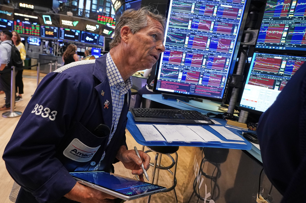 Trader Robert Charmak works on the floor of the New York Stock Exchange, Friday, June 26, 2026. (AP Photo/Richard Drew)