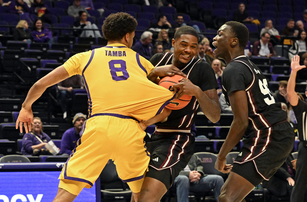 Mississippi State guard Shawn Jones Jr. (5) pulls the ball away from LSU forward Pablo Tamba (8) as forward Achor Achor looks on during an NCAA college basketball game, Wednesday, Jan 28, 2026, in Baton Rouge, La. (Hillary Scheinuk/The Advocate via AP)