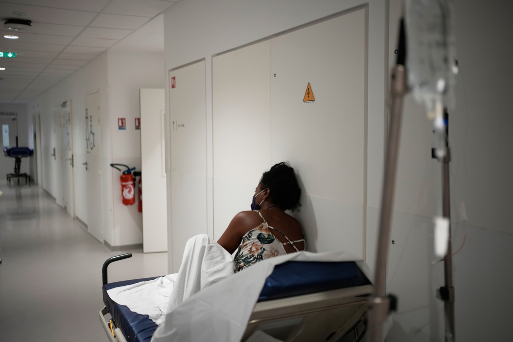 A patient waits before being treated at the emergency department of the Paris-Saclay Hospital, outside Paris, Tuesday June 30, 2026. (AP Photo/Christophe Ena )