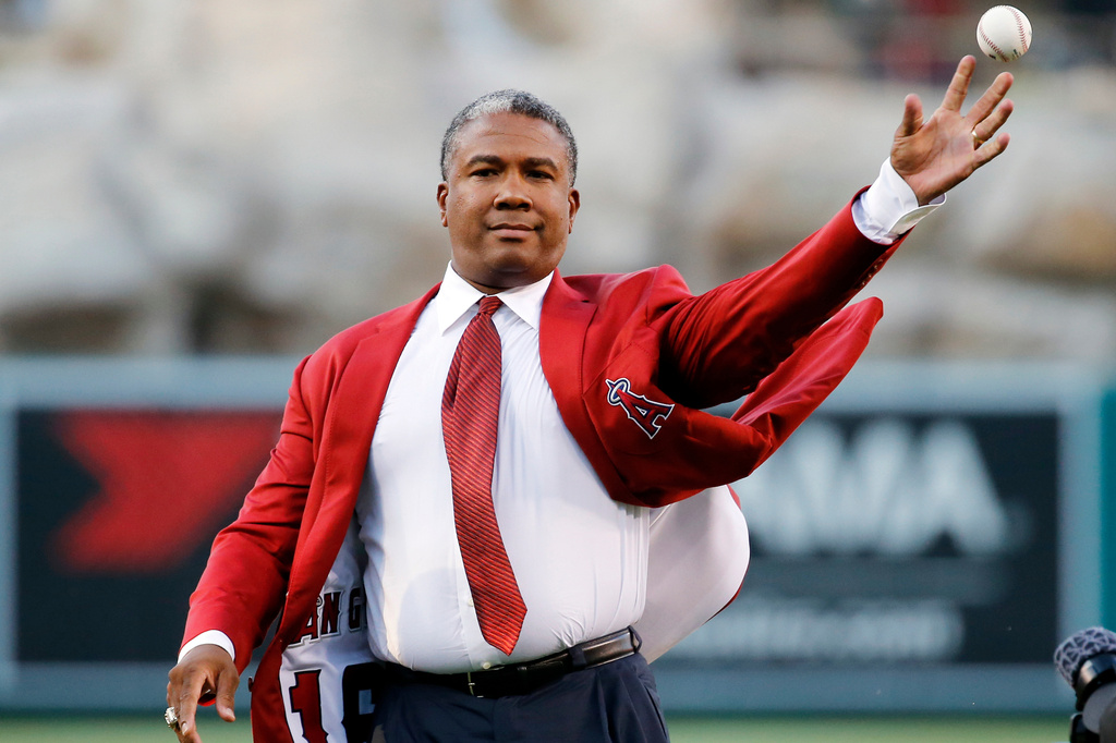 FILE - Former Los Angeles Angels outfielder Garret Anderson throws the ceremonial first pitch after he was inducted into the Angels Hall of Fame during ceremonies before a baseball game between the Angels and the New York Yankees in Anaheim, Calif., Saturday, Aug. 20, 2016. (AP Photo/Reed Saxon, File)
