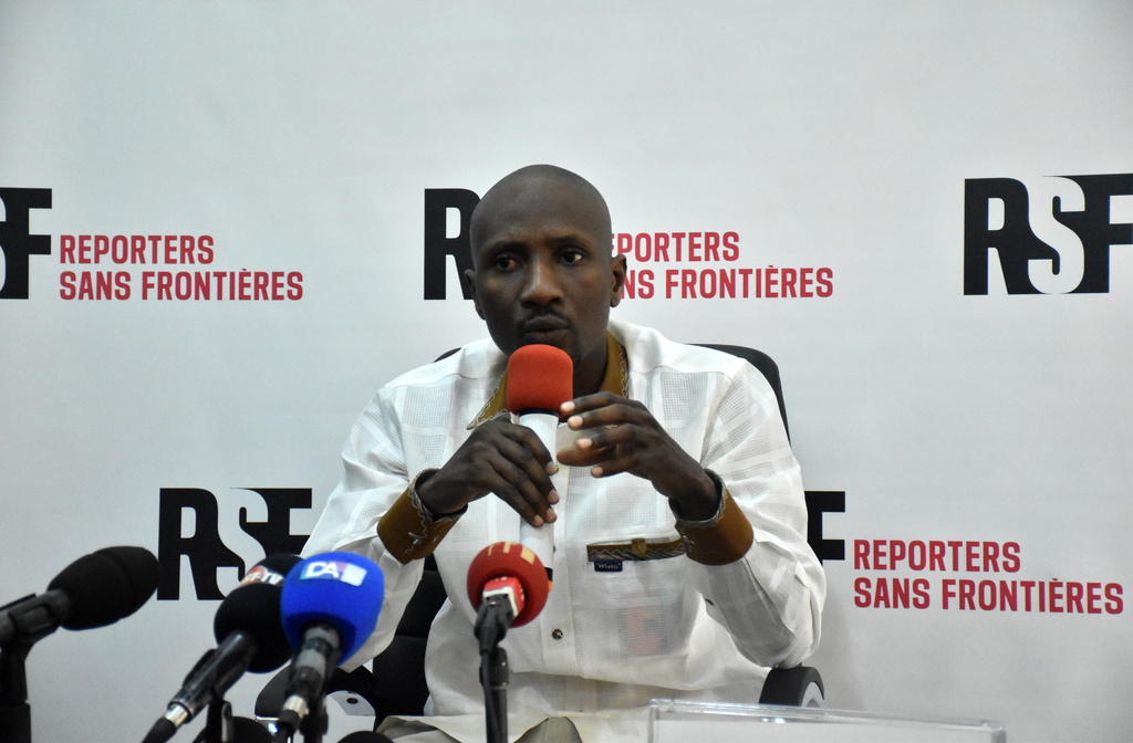 In this photo released by Reporters Without Borders, Burkinabe journalist Atiana Serge Oulon speaks at a news conference in Dakar, Senegal, on April 3, 2023. (Reporters Without Borders via AP)