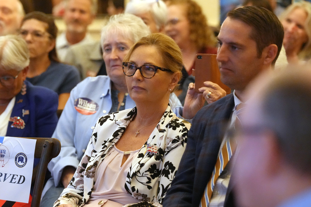 Sen. Darline Graham, R-S.C., center, waits for her turn to speak at a candidate event for hopefuls vying in a special Republican primary to replace her late brother Sen. Lindsey Graham, R-S.C., on November ballots, Saturday, Aug. 8, 2026, in Florence, S.C. (AP Photo/Meg Kinnard)