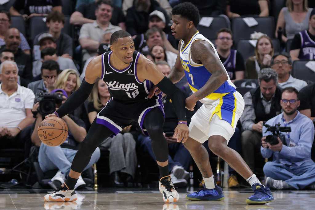 Sacramento Kings guard Russell Westbrook (18) is guarded by Indiana Pacers guard Kam Jones (7) during the first half of an NBA basketball game Tuesday, March 10, 2026, in Sacramento, Calif. (AP Photo/Scott Marshall)