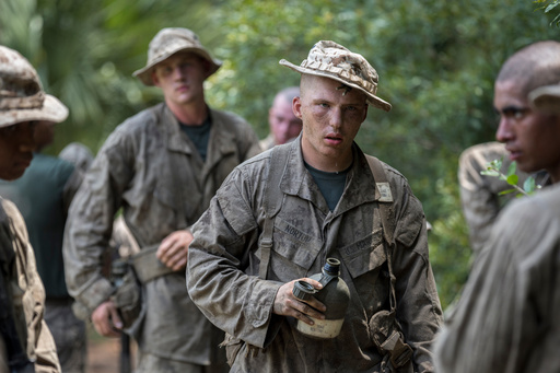 FILE - A U.S. Marine Corps male recruit takes a water break between obstacles during during a portion of training known as the Crucible at the Marine Corps Recruit Depot, June 29, 2023, in Parris Island, S.C. (AP Photo/Stephen B. Morton, File) FILE - A U.S. Marine Corps male recruit takes a water break between obstacles during during a portion of training known as the Crucible at the Marine Corps Recruit Depot, June 29, 2023, in Parris Island, S.C. (AP Photo/Stephen B. Morton, File)