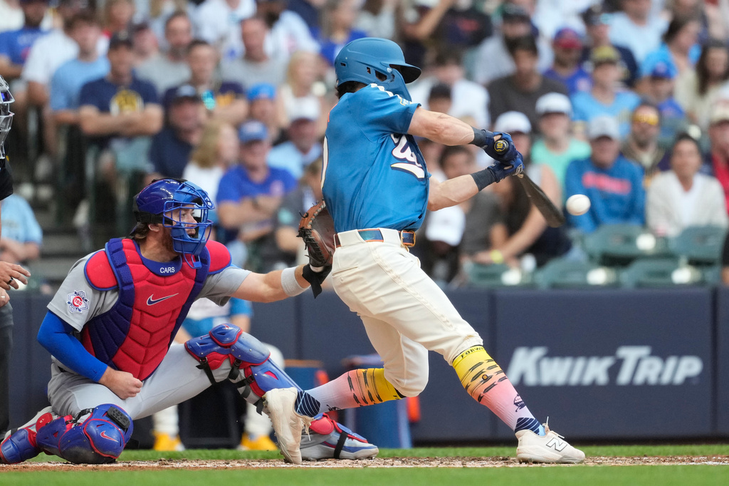 Milwaukee Brewers' Sal Frelick hits an RBI single during the fifth inning of a baseball game against the Chicago Cubs, Saturday, June 27, 2026, in Milwaukee. (AP Photo/Aaron Gash)