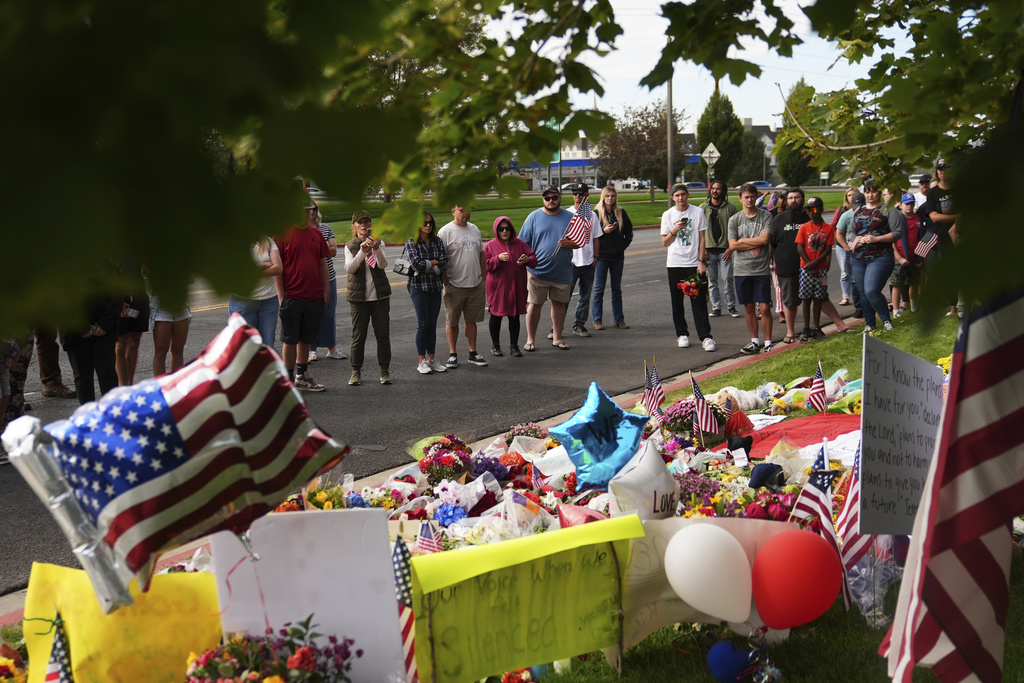 Supporters gather at a makeshift memorial in Orem, Utah, Saturday, Sept. 13, 2025, at Utah Valley University for Turning Point USA CEO and co-founder Charlie Kirk who was fatally shot during an event on the campus. (AP Photo/Lindsey Wasson)