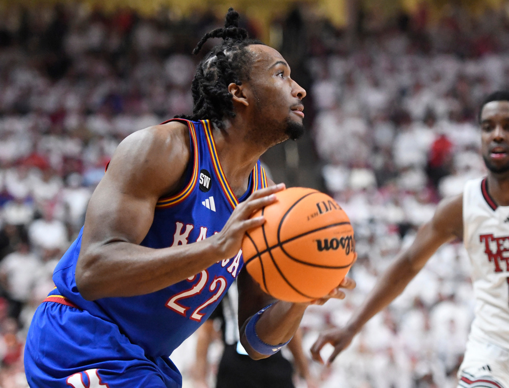 Kansas guard Darryn Peterson (22) looks to shoot during the second half of an NCAA college basketball game against Texas Tech, Monday, Feb. 2, 2026, in Lubbock, Texas. (AP Photo/Annie Rice)