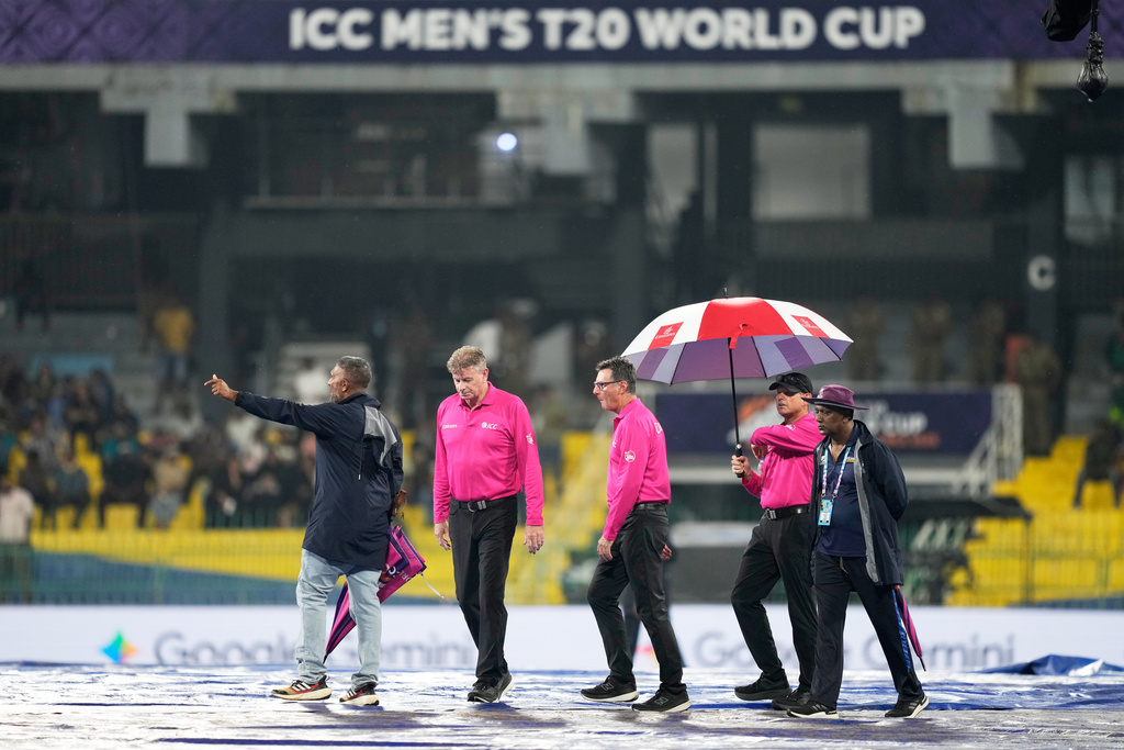Match umpires inspect the ground before the start of the T20 World Cup cricket match between New Zealand and Pakistan in Colombo, Sri Lanka, Saturday, Feb. 21, 2026. (AP Photo/Eranga Jayawardena)
