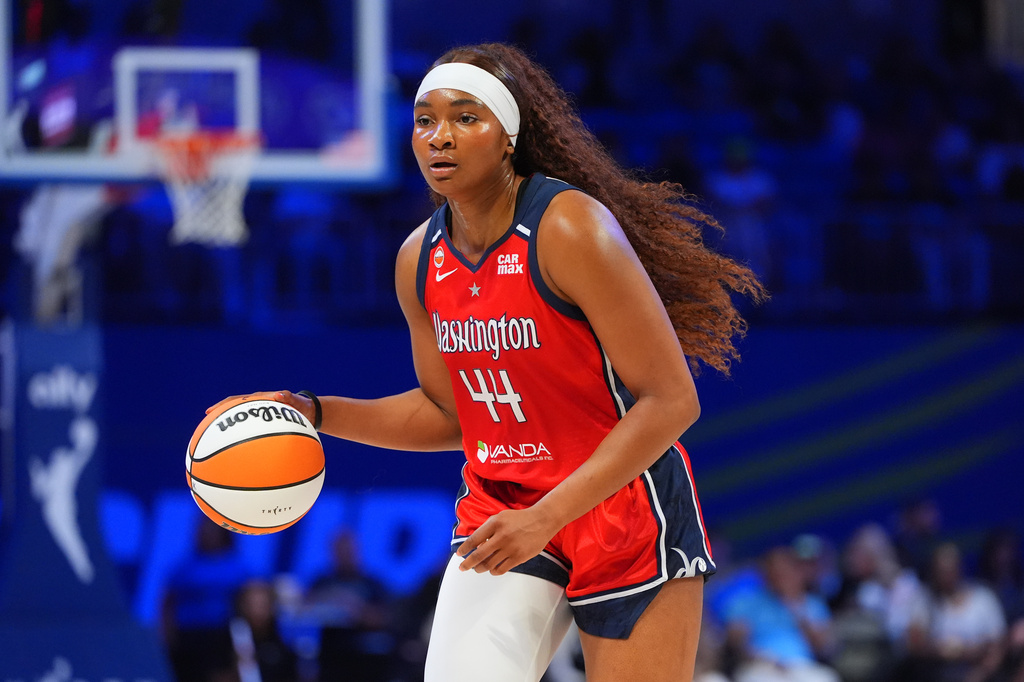 FILE - Washington Mystics forward Kiki Iriafen dribbles during the first half of a WNBA basketball game against the Dallas Wings in Arlington, Texas, May 18, 2026. (AP Photo/LM Otero, File)