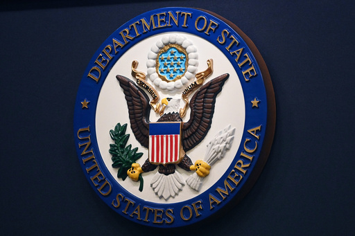 FILE - The State Department seal is seen on the briefing room lectern at the State Department in Washington, Jan. 31, 2022. (Mandel Ngan, Pool via AP, File) FILE - The State Department seal is seen on the briefing room lectern at the State Department in Washington, Jan. 31, 2022. (Mandel Ngan, Pool via AP, File)