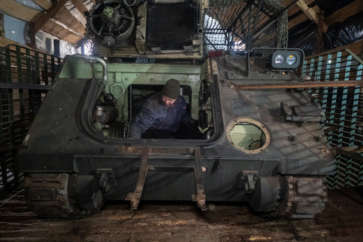 Ukrainian soldiers from repair and recovery battalion of the 57th separate brigade repair an armoured personnel carrier (APC) outskirts Kharkiv, Ukraine, Monday, Oct. 20, 2025. (AP Photo/Andrii Marienko) Ukrainian soldiers from repair and recovery battalion of the 57th separate brigade repair an armoured personnel carrier (APC) outskirts Kharkiv, Ukraine, Monday, Oct. 20, 2025. (AP Photo/Andrii Marienko)