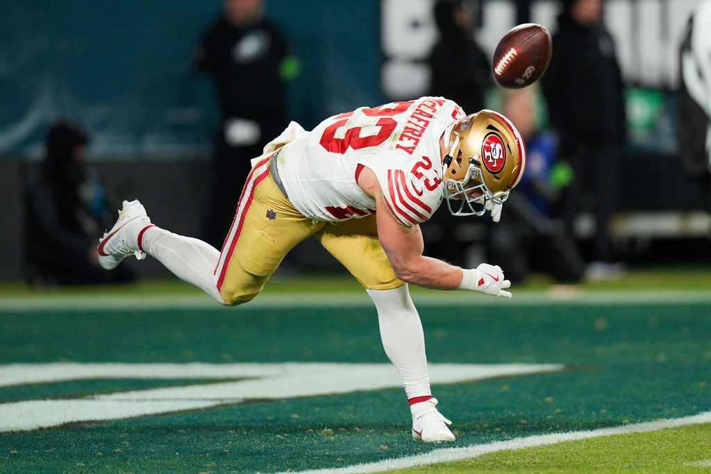 San Francisco 49ers running back Christian McCaffrey celebrates scoring a touchdown during the second half of an NFL wild-card playoff football game against the Philadelphia Eagles on Sunday, Jan. 11, 2026, in Philadelphia. (AP Photo/Chris Szagola)