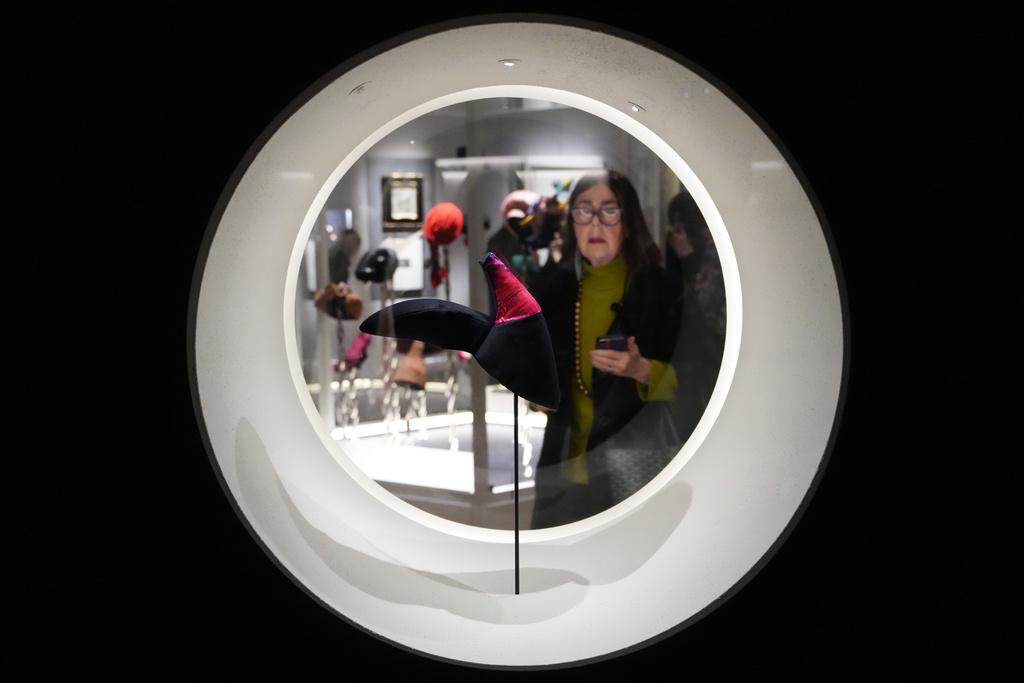 A visitor looks at a display called Shoe Hat during the press preview for Schiaparelli: Fashion Becomes Art exhibition at the V&A museum in London, Wednesday, March 25, 2026. (AP Photo/Kirsty Wigglesworth)