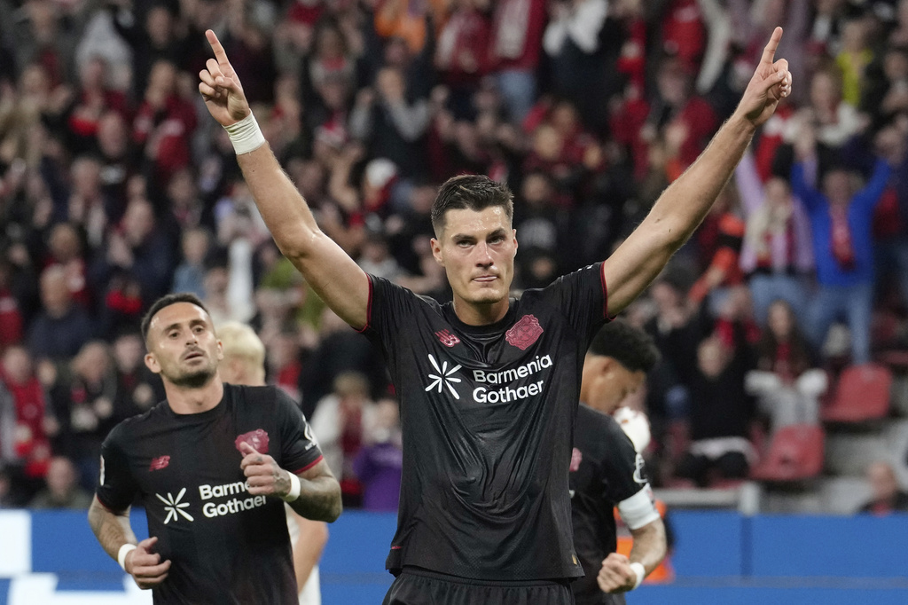 Leverkusen's Patrik Schick celebrates after he scored his side's second goal from the penalty spot during the German Bundesliga soccer match between Bayer Leverkusen and Eintracht Frankfurt at the BayArena in Leverkusen, Germany, Friday, Sept. 12, 2025. (AP Photo/Martin Meissner)